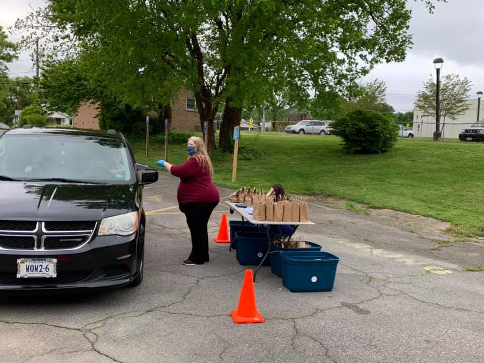 submitted photo handing out earth day bags